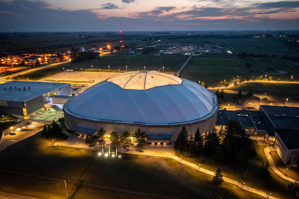 Exterior of the UNI-Dome at night.