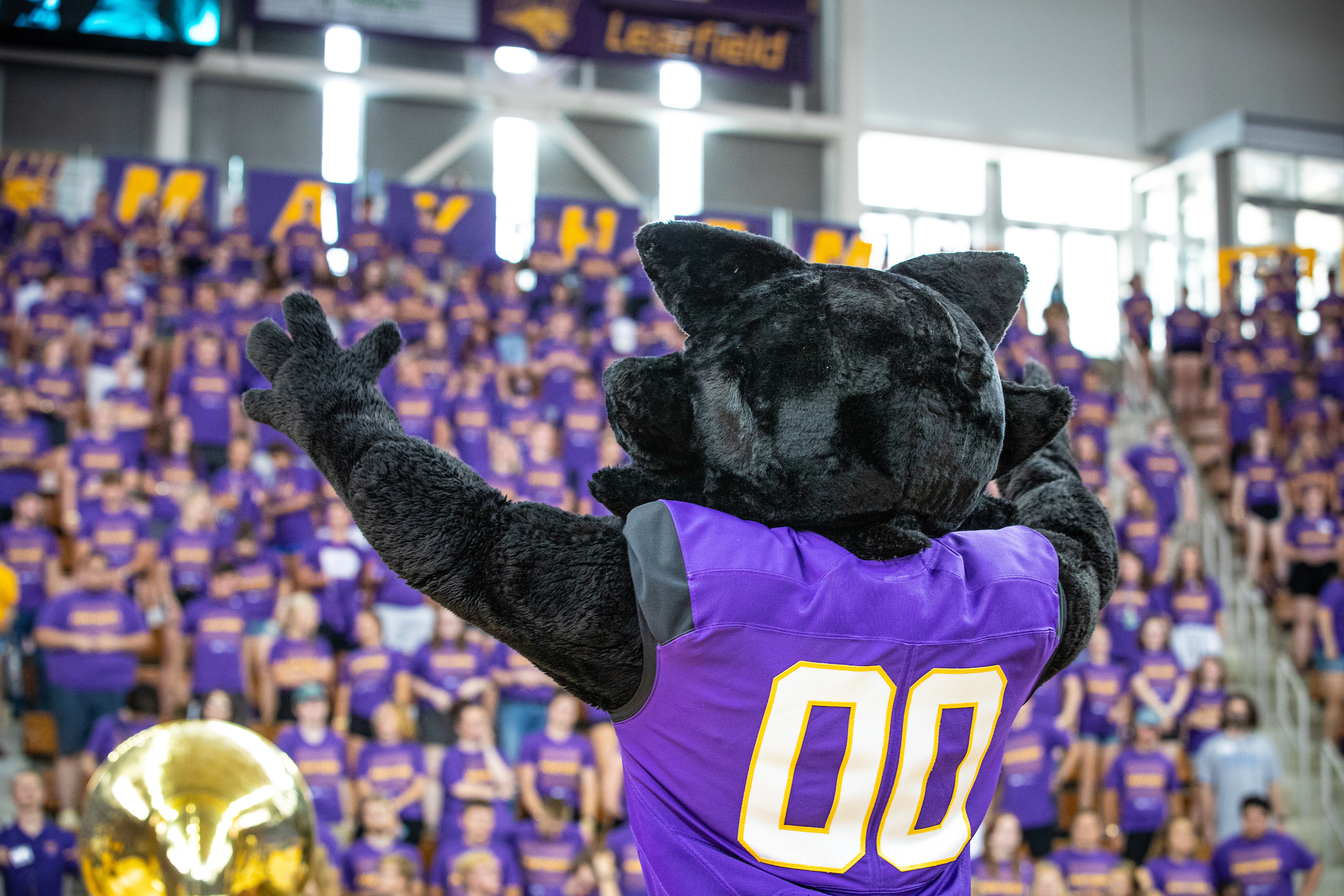 TC pumping up the student section at an event in the McLeod Center.